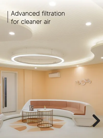 Advanced filtration systems for cleaner air are a key feature of luxury wellness design. This waiting area with its curved forms and soft lighting is designed to be a clean and calming environment.