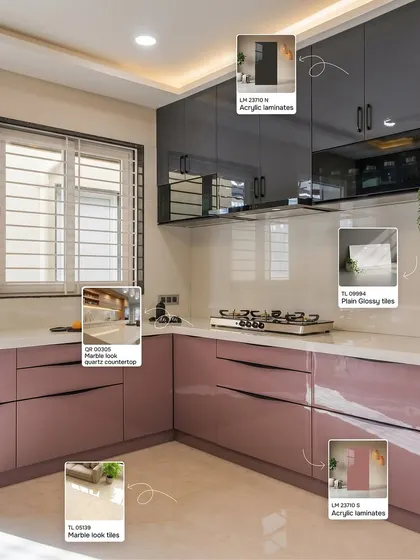 For a touch of modern glamour, this kitchen combines dusty pink and dark grey acrylic laminates. The look is completed with a marble-look quartz countertop and glossy backsplash tiles, creating a space that is both chic and functional.