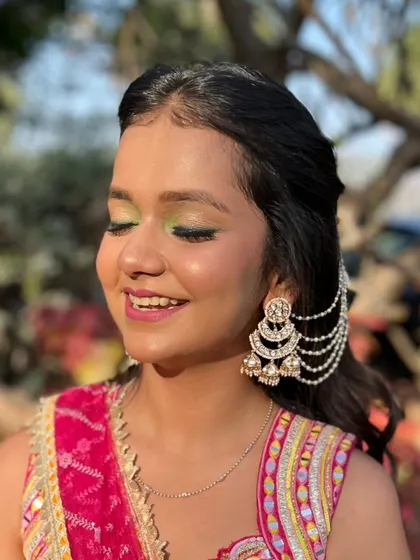 A close-up of the playful and colorful eye makeup.
