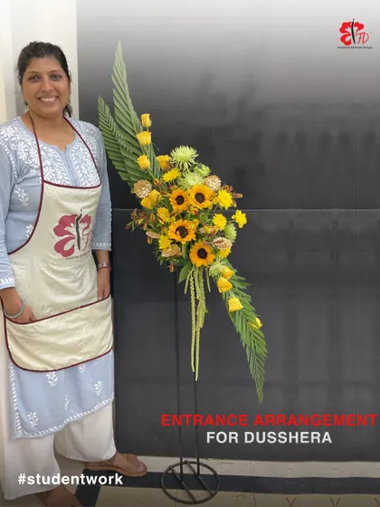 This stunning entrance arrangement for Dussehra was created by a student in our 9-month course. The design uses sunflowers and yellow roses to create a bright, welcoming, and festive statement piece.