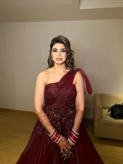 The full look, with Jasleen looking like a movie star in her reception gown and classic red choora bangles.