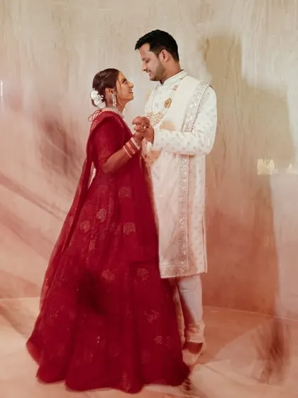 An artistic shot using a slow shutter speed to create a beautiful light trail effect around Katyayni and Kunal. This technique adds a sense of magic and movement to their portrait.