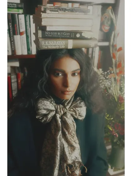A close-up portrait from "Roots," where the direct gaze of the model challenges the viewer to consider their own origins. The styling and composition are intentionally academic and thoughtful.