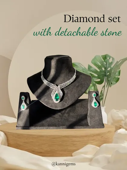 Two looks, one masterpiece. This diamond set is shown here with the vibrant emerald stone, offering a classic and regal look that can be easily swapped for a different mood.