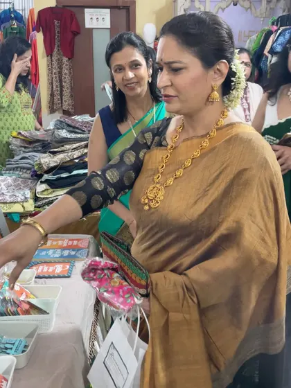 A candid shot of a visitor browsing through the collection at my exhibition stall.