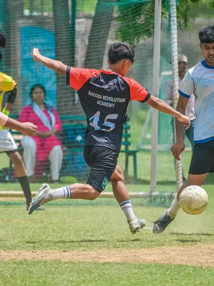 Intense action from a U14 match, where players showcase more advanced tactical skills and physical strength.