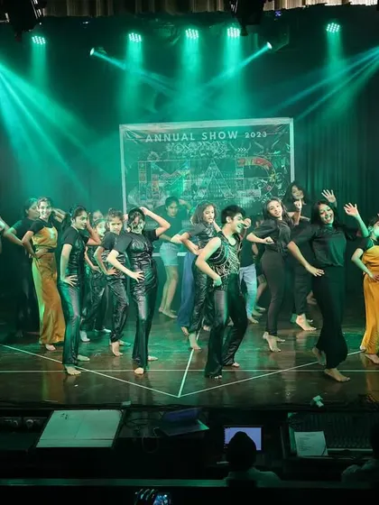The full view of a large group performance, capturing the impressive scale and energy of our annual showcase.