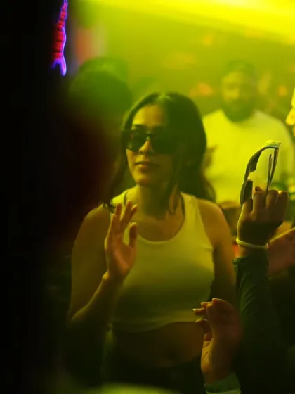 A cool, confident vibe from a guest on the dance floor, matching the Hip Hop and R&B tracks I spin.