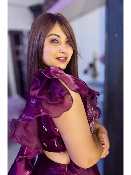 A soft and elegant party look. I used a beautiful mauve and plum color palette on the eyes and lips to complement the rich tones of her ruffled outfit, creating a sophisticated and modern style.
