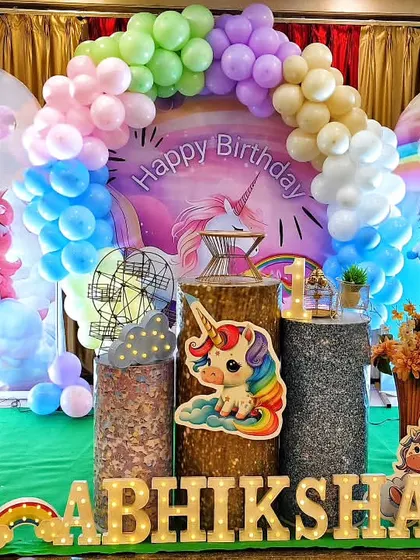A magical unicorn-themed birthday party filled with pastel rainbow colors. This enchanting decor features unicorn cutouts, rainbow balloon arrangements, and a custom backdrop, creating a whimsical wonderland for the birthday girl.
