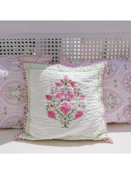A custom-embroidered cushion with a traditional block-print motif, adding a touch of heritage to the Mehendi seating.
