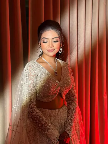 Creating a spotlight-stealing look for Ruchita's sangeet. The dramatic lighting highlights the shimmer on her eyes and the radiant glow of her skin.