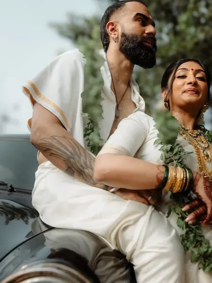 An effortlessly cool portrait of a couple with a vintage car. We blend modern style with classic elements to create unique and edgy wedding photos.