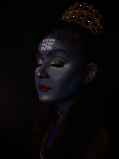 A meditative pose of the Lord Shiva makeup, highlighting the tripundra on the forehead and the calm expression.