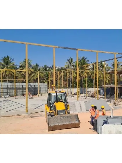 The structural framework for a large amenity building going up at Vaishnavi Tech Park. We oversee all aspects of construction, including hardscape structures, to ensure seamless integration with the landscape.