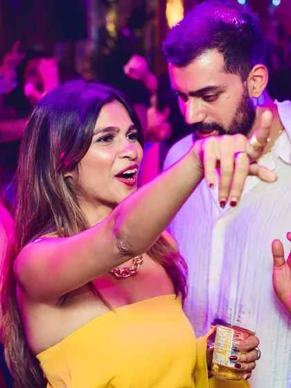 A couple dancing and pointing to the beat. The energy at our VIBE CHECK nights is always interactive and infectious.