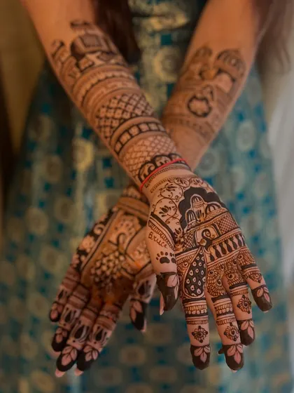 A beautiful close-up of the palm, featuring a paw print and the name 'Bruce', a sweet tribute to the bride's furry friend.