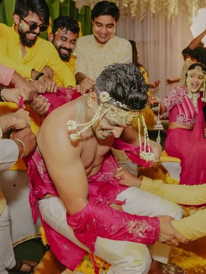 The 'kurta-faad' Haldi tradition, where the groom's friends playfully tear his shirt.