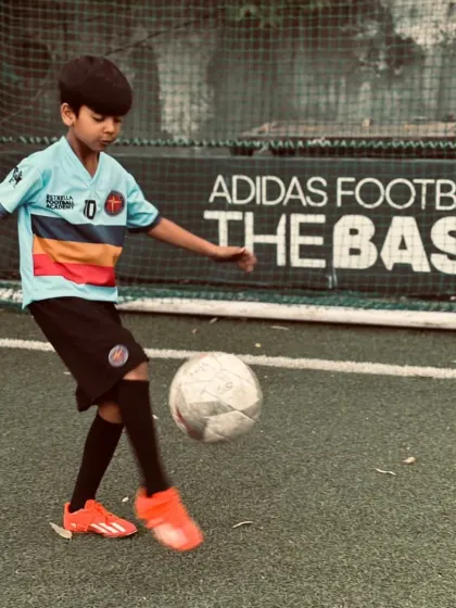 This is our talented number 10, showcasing his ball juggling skills. I encourage creativity and flair, as it builds a player's confidence and love for the game.