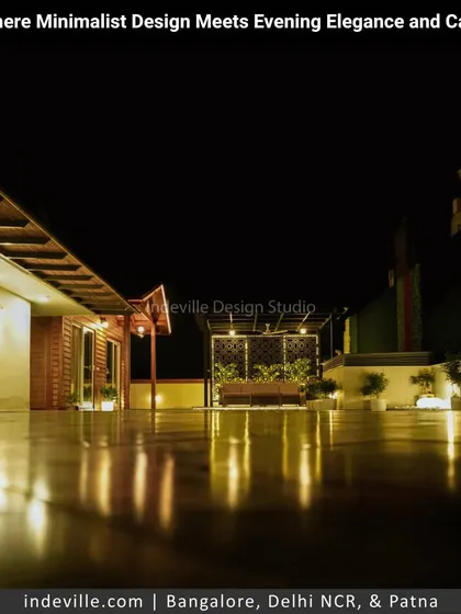 A low-angle shot of a minimalist terrace at night, where the glossy floor reflects the ambient lighting. This perspective highlights the sleek, expansive feel of the space I designed.