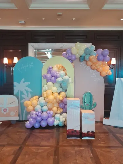 Celebrate the mom-to-be with our trendy and stylish baby shower decorations. This "Babychella" theme uses a beautiful pastel balloon cascade over modern arched backdrops, creating the perfect photo opportunity for your special day.