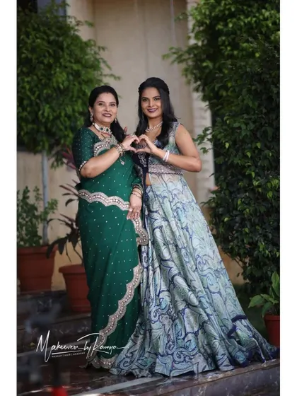 A duplicate of 158, showing the mother-daughter duo making a heart shape.