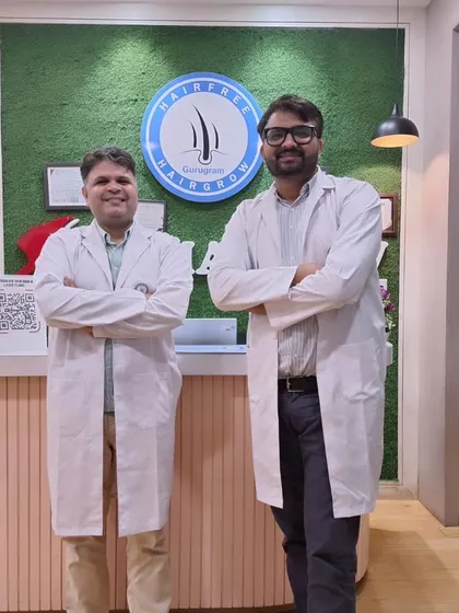 A picture of me with my colleague, Dr. Manish Jangra, at our Gurugram clinic. We work together to provide the best in dermatological and hair restoration care.