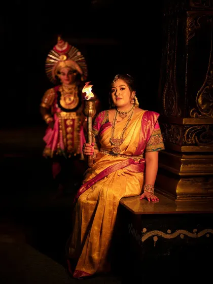 A powerful photo of actress Meghana Raj from the "Belaku" themed Navaratri shoot. Holding a torch, she represents the destruction of darkness and the arrival of light.