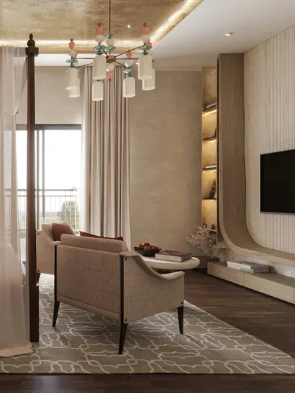 The seating area in this Zen-inspired bedroom features a custom TV unit with curved, organic lines and integrated shelving. The space is designed for rest and reflection, balancing grounding with grace.