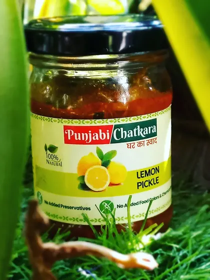 A jar of my zesty Lemon Pickle, perfect for those who love a tangy kick. It is 100% natural and made without any added chemical preservatives.