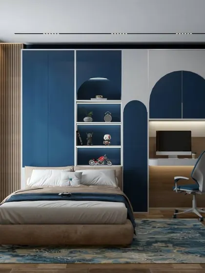 This blue and white bedroom has a futuristic feel with neon astronaut light art and arched shelving. The built-in desk and storage make it a complete and organized space for a child.