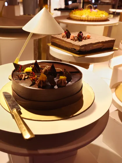 A selection of our whole cakes, including a rich chocolate mousse cake and a classic cheesecake. We offer a wide variety of cakes to suit any taste, all baked and decorated by our expert pastry chefs.