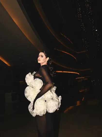 A dramatic, full-length shot from Lakme Fashion Week. The hair and makeup were designed to be bold and sculptural to match the incredible Shantanu & Nikhil creation.