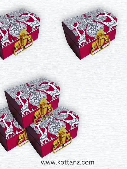 These Gajalakshmi-themed trunks are perfect for creating a memorable return gift. The unique curved shape and beautiful artwork make them a cherished keepsake.
