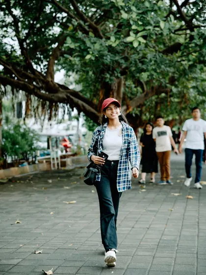 Another shot from the walking sequence, capturing a natural, in-between moment that feels authentic and unposed.