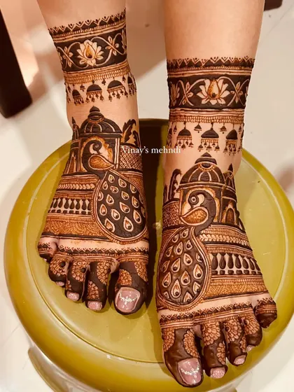 Another shot of the elegant peacock and jhumka feet design, showing the beautiful symmetry and clean application.