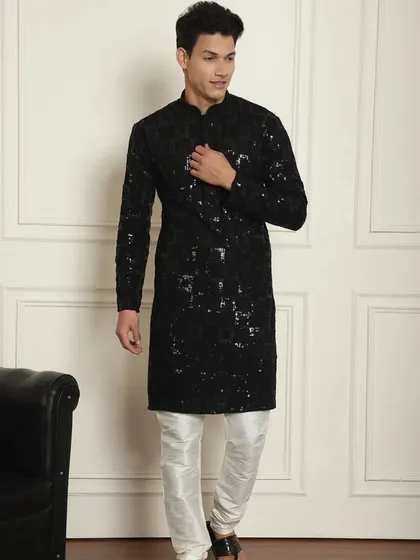 Ready to dazzle this Diwali? This black sequined kurta pajama is crafted to make every moment unforgettable. Step into the festivities in style.