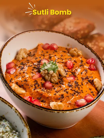 Our 'Sutli Bomb' is the rich and smoky Muhammara dip. Topped with walnuts and pomegranate, it's a burst of flavour that will be the highlight of your Diwali spread.