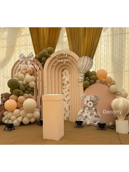 A detailed shot of the teddy bear party backdrop, showing the textured panels and hot air balloon accents.