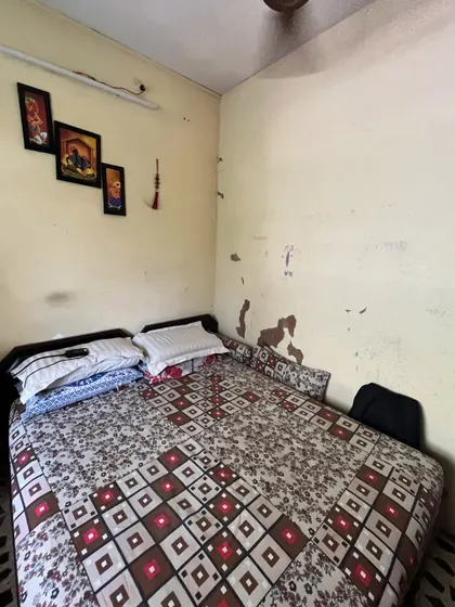 The kids' room in the Vora House before we began. It was a cramped space with peeling paint and dated furniture, in need of a complete overhaul.