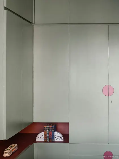 Detail of the kids' wardrobe, featuring a built-in niche for displaying toys and treasures.