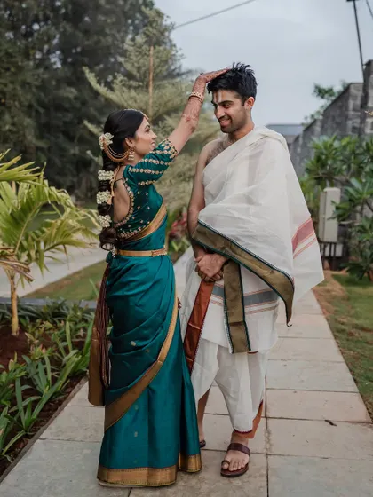 A classic portrait of the bride and groom in their traditional South Indian wedding attire. We ensure you get those timeless shots that beautifully represent your heritage and your union.
