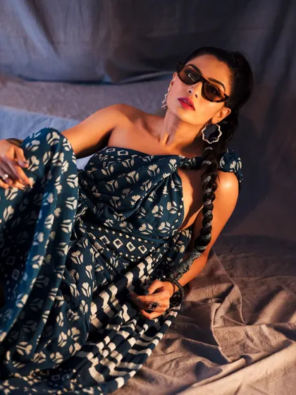 This shot captures the playful side of the 'naughty hottie' concept. The braided hair and direct gaze add to the unique styling.