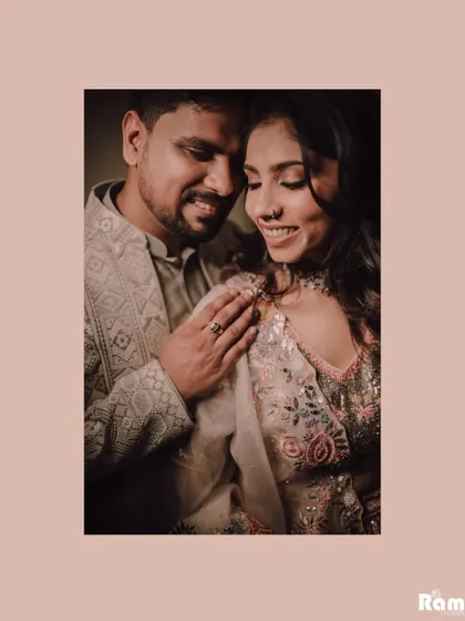 An intimate and warm portrait of a newly engaged couple. The soft lighting and their gentle smiles create a feeling of comfort and deep affection.