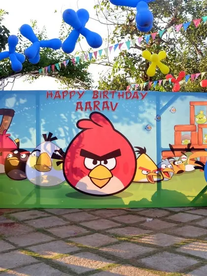 The main photo backdrop for an Angry Birds birthday, featuring all the popular characters from the game in a vibrant, playful scene.
