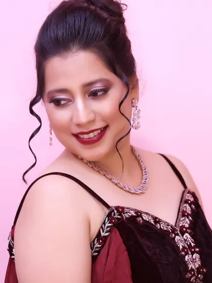 Makeup that makes you feel like a queen. This look features a dramatic smokey eye with a hint of shimmer and a deep red lip, perfect for a cocktail party.