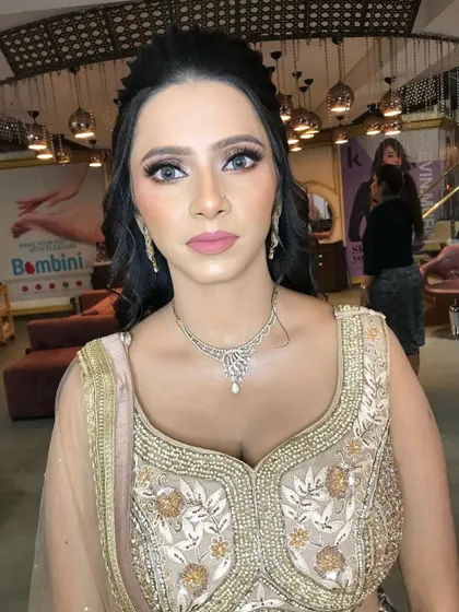 A close-up of a soft glam engagement look. I used neutral tones on the eyes and a soft pink lip to enhance her features naturally.