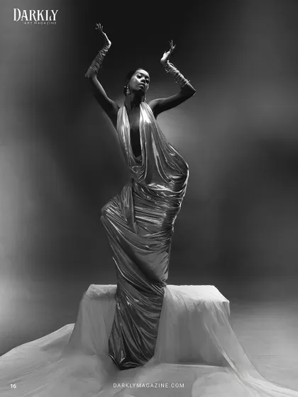 Another powerful shot from the "Ascension" series, where the pose and the lighting highlight the sleek hair and the defined, elegant makeup, creating a sense of divinity and movement.