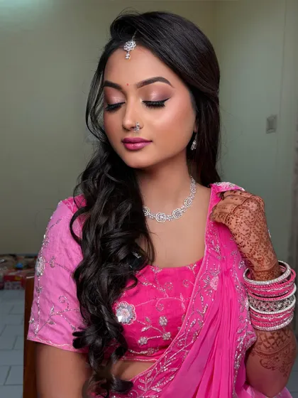 Meena on her engagement day. This soft pink monochrome look, with a shimmery pink eyeshadow and matching lehenga, is fresh, youthful, and perfect for an engagement party.