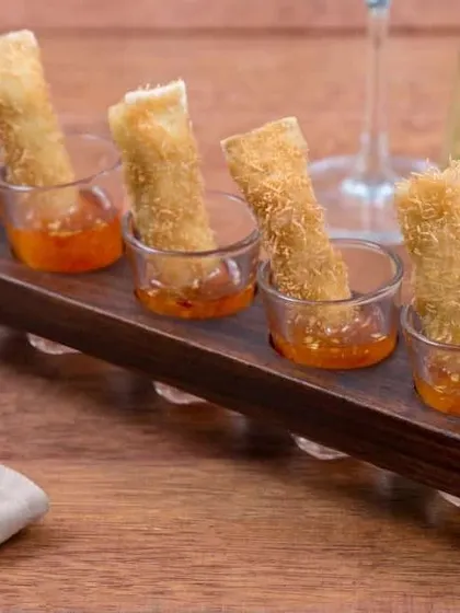 Our modern take on a classic spring roll, served individually with a sweet chili dipping sauce. This dish represents our philosophy of evolving traditional recipes with contemporary plating.